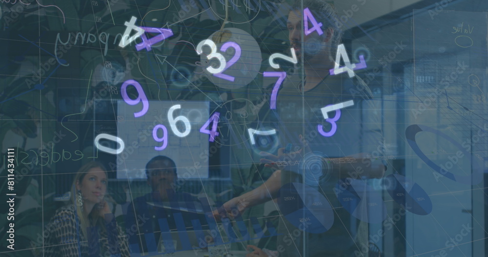 Fototapeta premium Image of floating numbers over diverse businesspeople during presentation