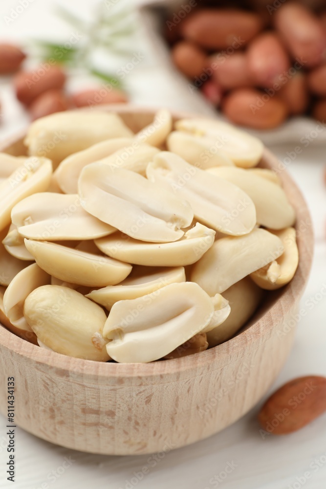 Fresh peanuts in bowl on table, closeup Fresh peanuts in bowl on table, closeup