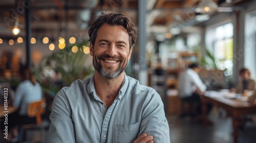 Happy Employees in Modern Office of a Successful Company - Wide Shot with Genuine Smiles and Depth of Field