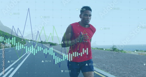 Image of multiple graphs and changing numbers over african american athlete running on road