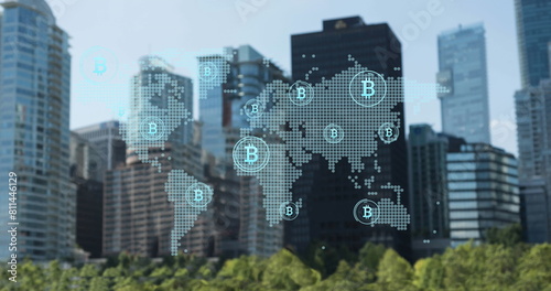 Image of bitcoin and world map over skyscrapers