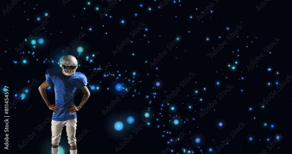 Image of american football player in helmet with arms crossed over glowing blue spots Image of american football player in helmet with arms crossed over glowing blue spots