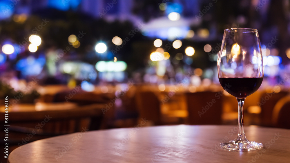 glass of wine on table top with night cafe background. National Wine Day. Generative Ai glass of wine on table top with night cafe background. National Wine Day. Generative Ai