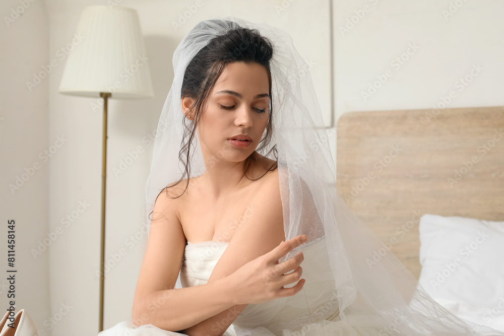 Beautiful young bride in bedroom Beautiful young bride in bedroom