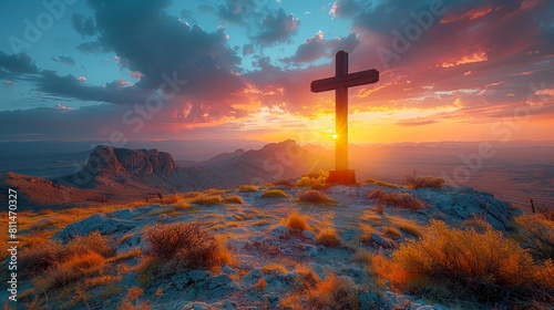 a cross in a desert with colorful sunset in the background