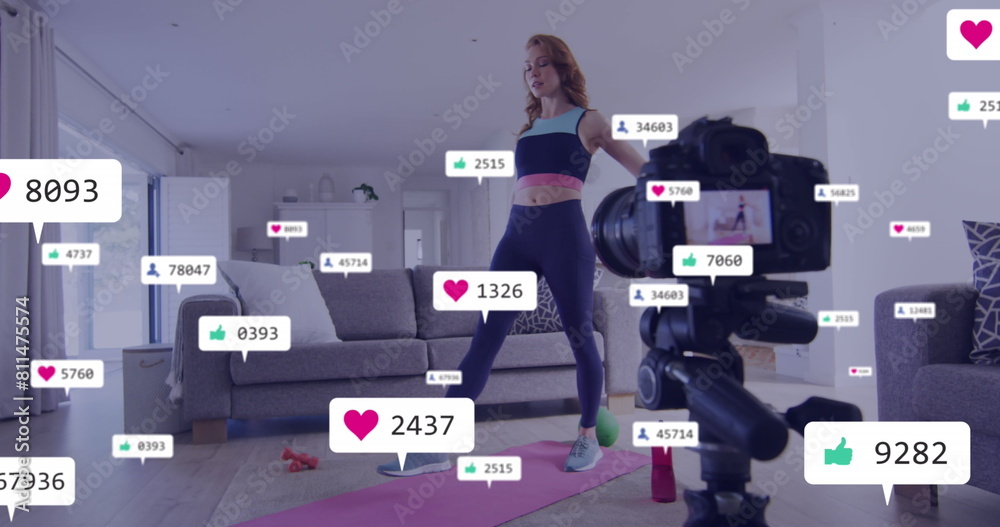 Image of notification bars over caucasian woman recording yoga in camera at home Image of notification bars over caucasian woman recording yoga in camera at home