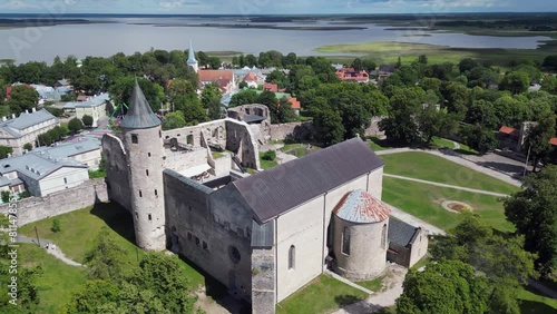 Aerial orbits medieval castle ruin in Haapsalu Estonia, tourist site photo