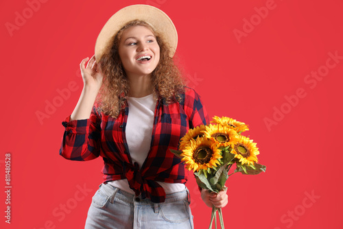 Happy young woman with sunf...