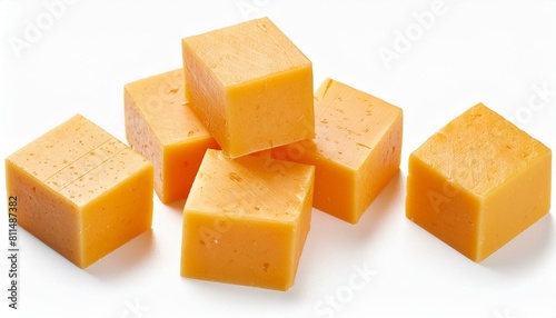 Cheddar cheese cubes isolated on a white background. Top view