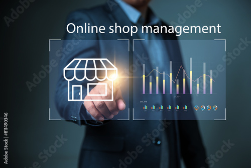 Online shop management, Businessman using software to manage a shop and franchise. photo