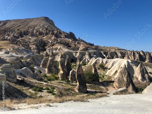 Aerial drone shot of the Fairy Chimneys over the landscape of Goreme, Cappadocia.