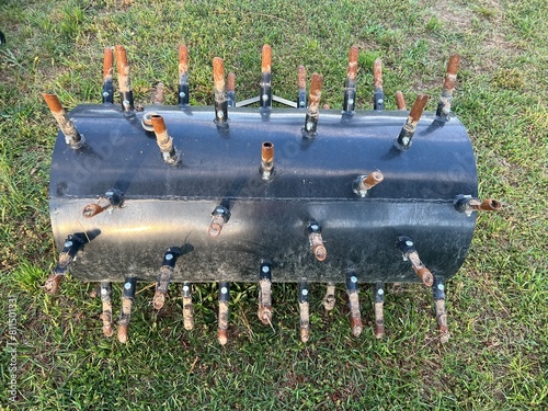 Manual push core aerator with aeration tines for lawns