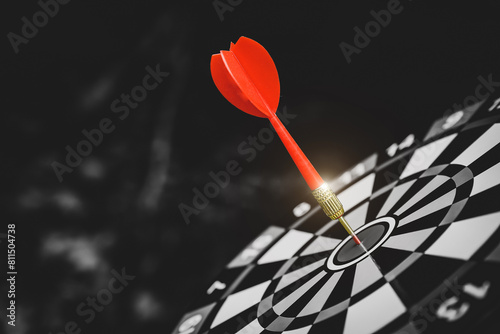 Target bullseye or Bulls eye or dartboard has red dart arrow throw hitting the center of a shooting for financial business targeting planning growth and aim to winner goal of business win concept.