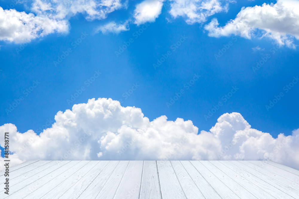 Blue sky and clouds with wooden floor and space for add text above Blue sky and clouds with wooden floor and space for add text above