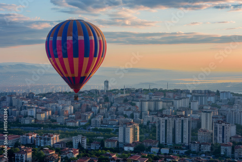Summer festivals and events, Vibrant hot air balloon against the backdrop of a metropolis at sunset and sunrise, with space for text