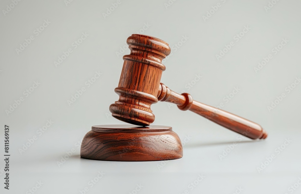 Photo of a wooden gavel on a white background, isolated on a clean and simple backdrop Photo of a wooden gavel on a white background, isolated on a clean and simple backdrop