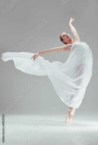 Ballet, performance and woman with fabric in studio for dancing, balance and art or sport. Female dancer, talent and fitness by white background for movement, beauty and artist training in theatre