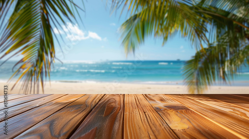 mockup for advertising travel  sunscreen  cocktails  beach food and clothing. polished wooden table platform lower foreground blurred tropical beach scene  including palm tree fronds