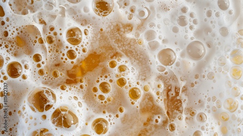 Overflowing beer with too much foam, perfectly captured from above.
