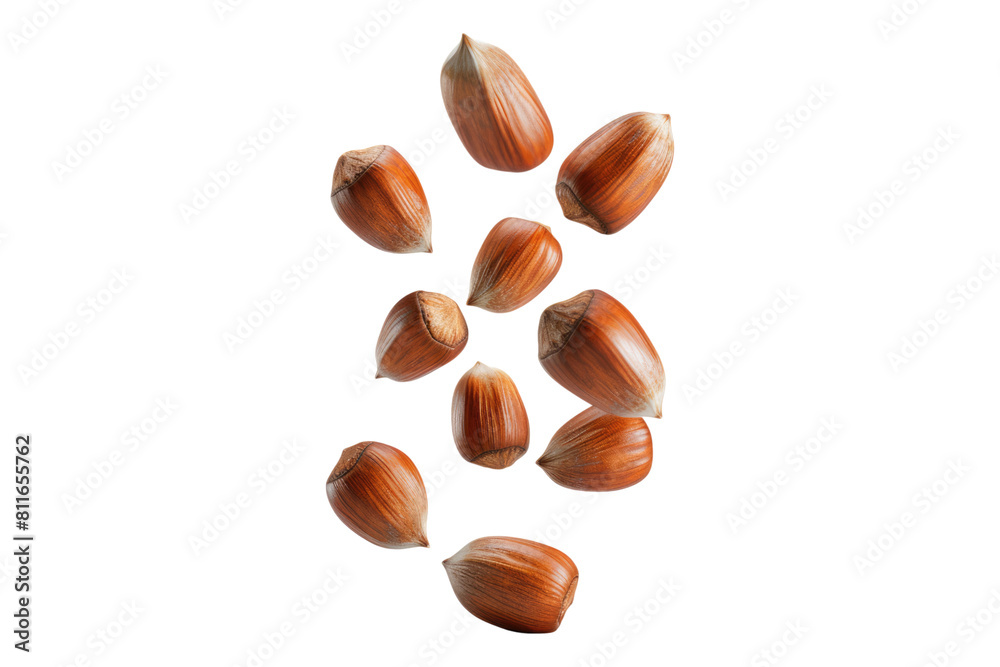 Falling whole hazelnuts isolated on transparent background