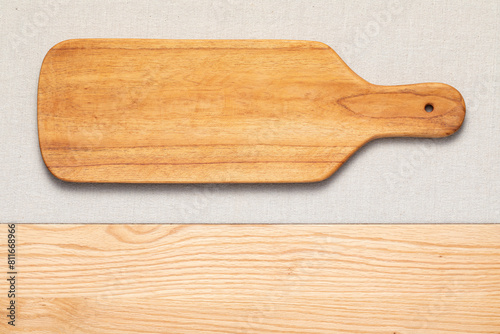 Handmade long wooden cutting board on the countertop. Long wooden pallet.