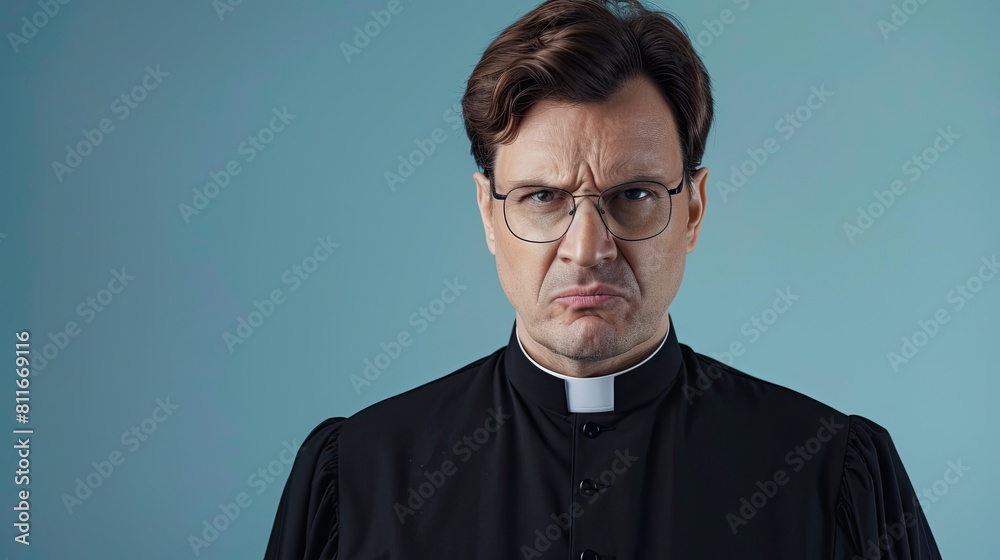 Upset priest isolated on pastel blue background