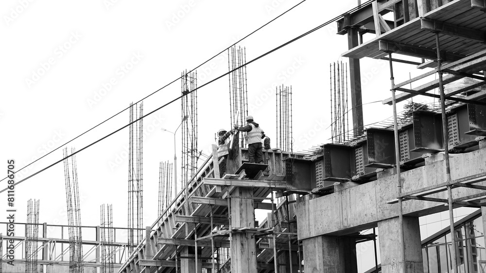 Construction Workers On Building Site High Angle View Black And White