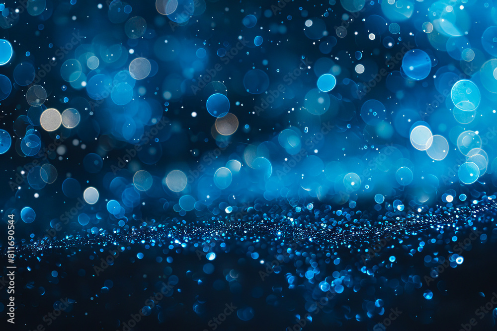 A blue background with bokeh lights. A blue background with bokeh lights.