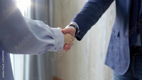 Handshake of two business people in formal business attire, close up. Symbolizing agreement, Partnership, and Collaboration