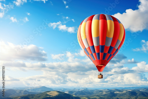 Hot air balloon flying high in blue sky. Background with selective focus and copy space