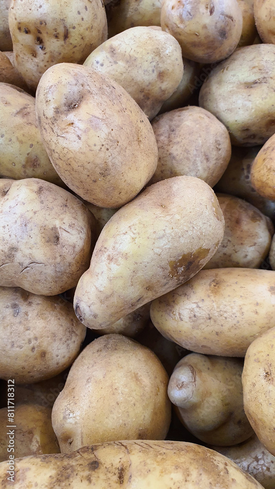 Close up pile of fresh potatoes placed together in local market as a background. Close up pile of fresh potatoes placed together in local market as a background.