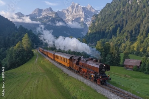 The image showcases an old-fashioned steam train chugging through a verdant valley with the Alps towering in the background