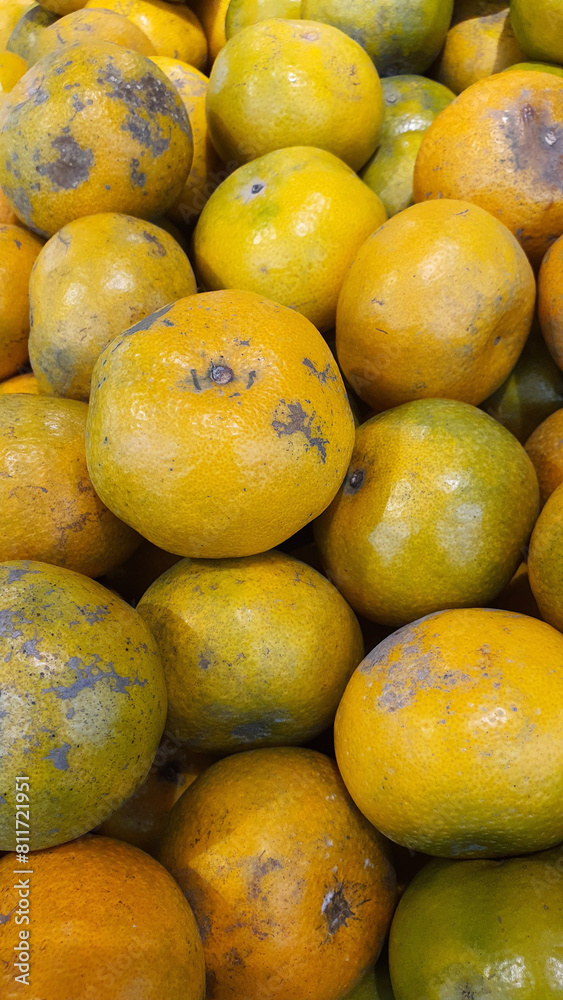 Close up pile of tasty fresh oranges sold at the market as a background. Close up pile of tasty fresh oranges sold at the market as a background.