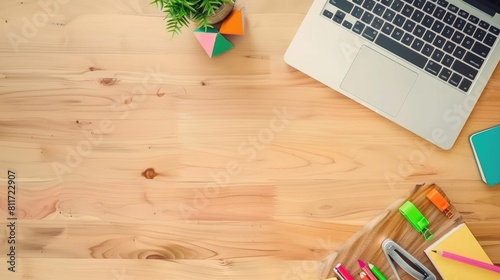 A rectangular wooden desk with a laptop, notebooks, pencils, and a potted plant. The flooring has a grass pattern, giving a natural and artistic touch to the space AIG50