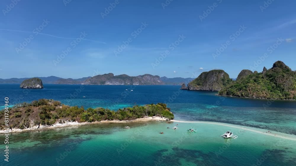 Aerail view of tropical exotic island sand bar separating sea in two with turquoise in El Nido, Palawan, Philippines. Aerail view of tropical exotic island sand bar separating sea in two with turquoise in El Nido, Palawan, Philippines.