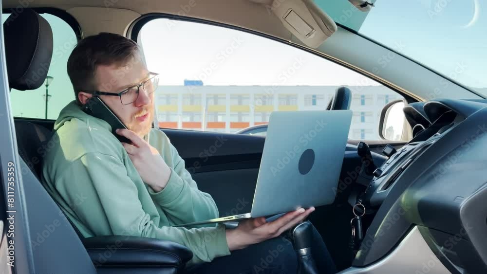 man in the car. hold the laptop. slow motion video. High-quality shooting in 4K man in the car. hold the laptop. slow motion video. High-quality shooting in 4K