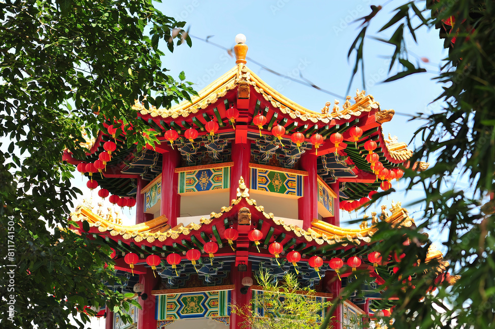 golden dragon sculpture red lanterns on traditional chinese roof