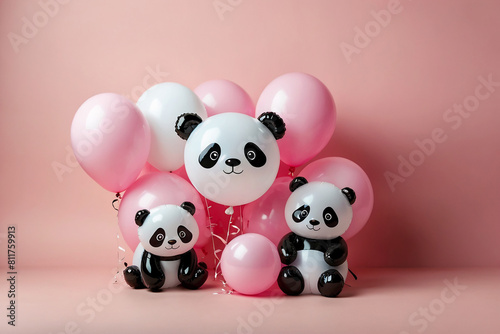 Pink and white panda balloons against a soft pink background. Copy space.