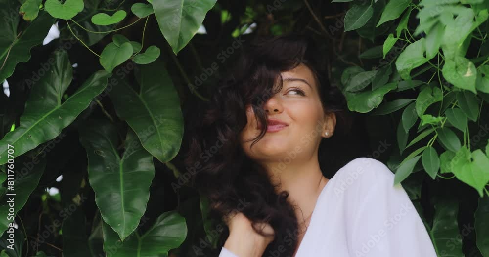 Natural Hair Care Portrait of Young Woman in Exotic Tropical Foliage Natural Hair Care Portrait of Young Woman in Exotic Tropical Foliage