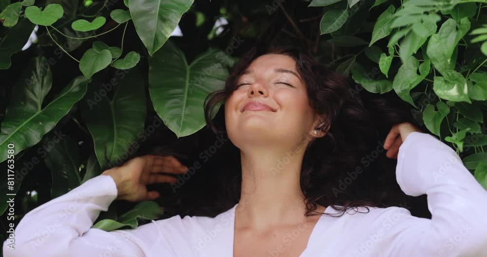 Natural Hair Care Portrait of Young Woman in Exotic Tropical Foliage Natural Hair Care Portrait of Young Woman in Exotic Tropical Foliage