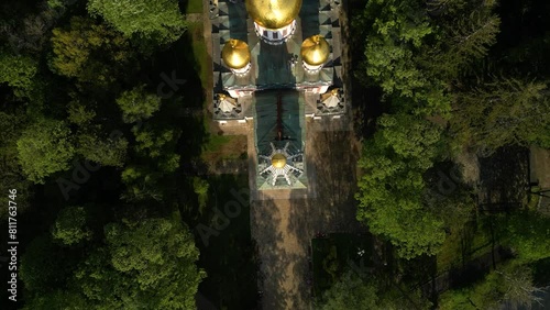 Aerial drone footage of the Shipka Memorial Church near the town of Shipka in Bulgaria. High angle shot of the Memorial Temple of the Birth of Christ in the Thracian valley. Summer green woods.
 photo