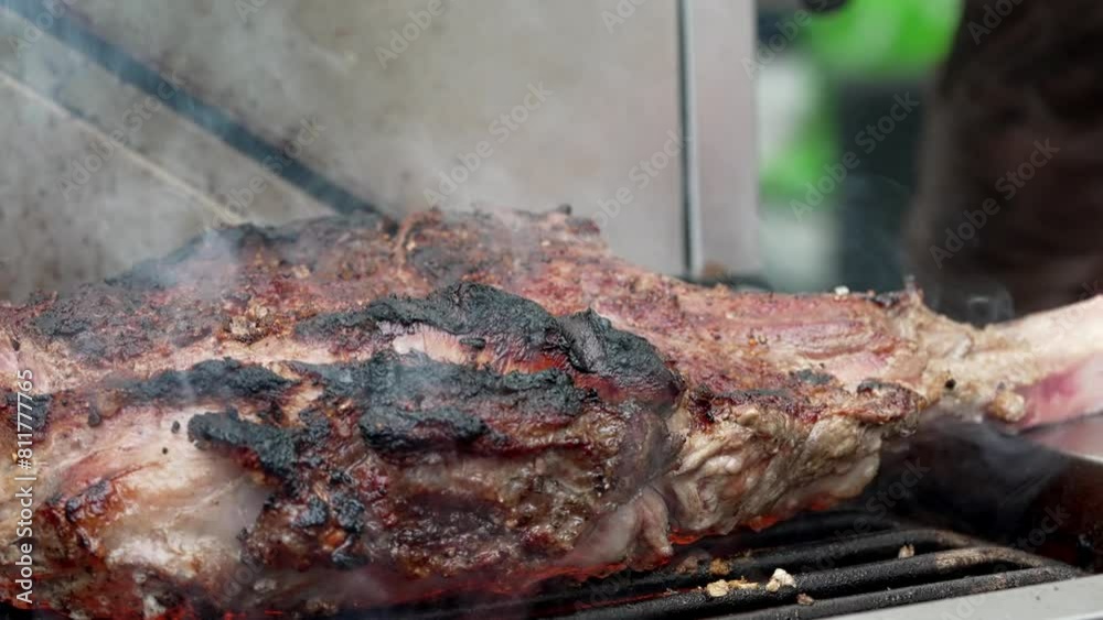 A product of animal origin, most likely beef , sizzles on the grill, emitting enticing flavors. Animal fat is used in the cooking process, and it is soon served as a delicious dish in this kitchen A product of animal origin, most likely beef , sizzles on the grill, emitting enticing flavors. Animal fat is used in the cooking process, and it is soon served as a delicious dish in this kitchen