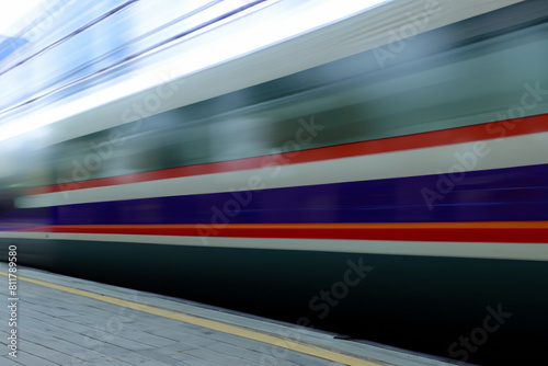 Train. Modern high-speed train moves on the platform of the station. Electric train on the platform of the railway station. Railroad tracks at sunset. Railway travel concept.