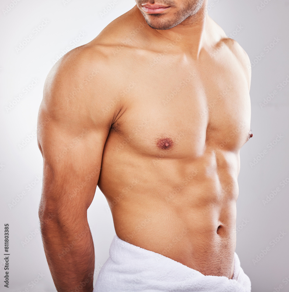 Abs, towel and fitness in studio, person and health of body with workout, exercise and gym. Sports, athlete and bodybuilder with muscle, strong and wellness for abdomen, model and white background Abs, towel and fitness in studio, person and health of body with workout, exercise and gym. Sports, athlete and bodybuilder with muscle, strong and wellness for abdomen, model and white background