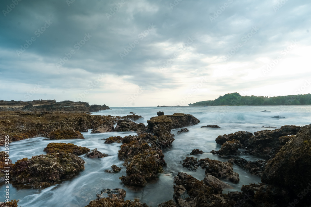 seascape is very beautiful with coral rocks and sea water that looks very soft like cotton. slow shutter speed effect seascape is very beautiful with coral rocks and sea water that looks very soft like cotton. slow shutter speed effect