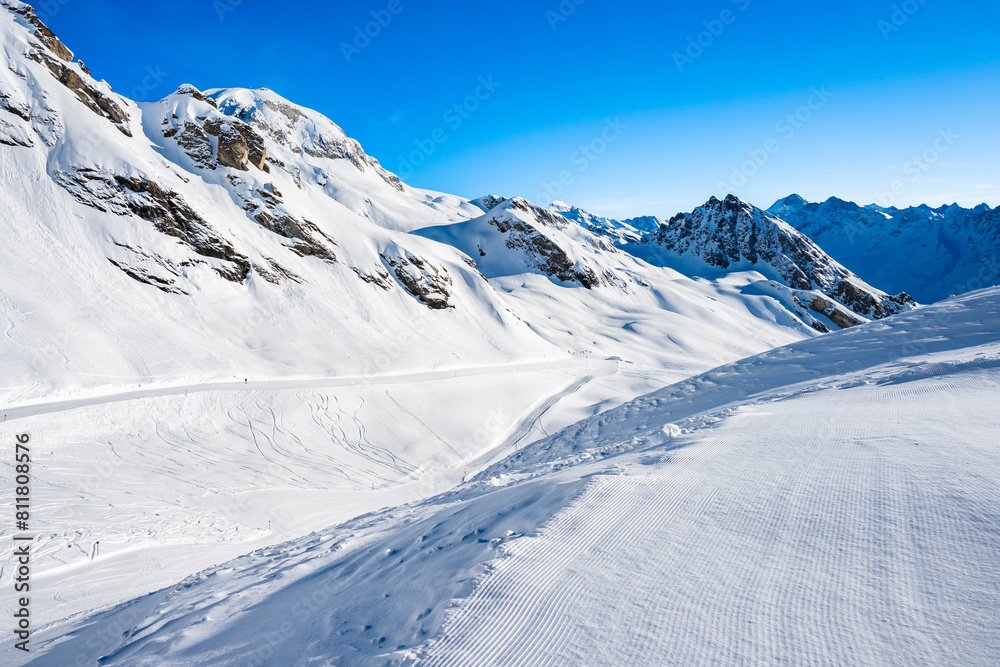 Ski run in winter resort with mountains in background, Loetschental valley, Switzerland