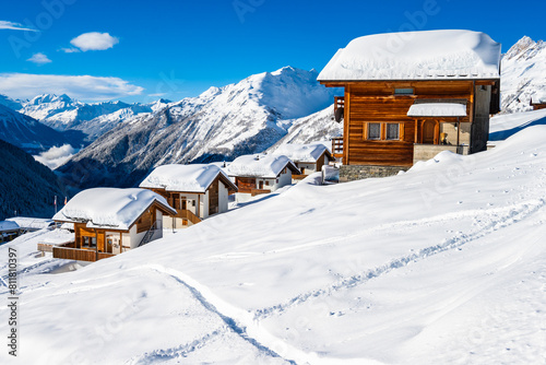 Traditional alpine wooden houses in winter mountain snow landscape, Loetschental valley, Switzerland © pkazmierczak