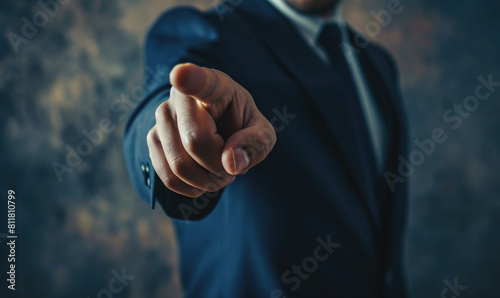 A man in a suit pointing to something