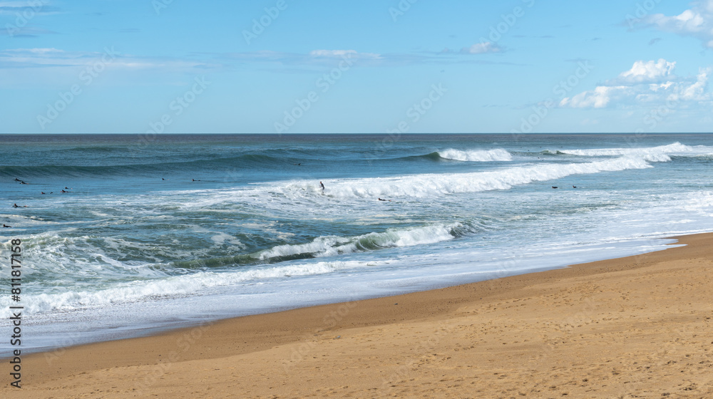 Surfers Sea Waves on Sandy Beach Texture Background, Transparent Ocean Water, Blue Sky, Sunny Shore Surfers Sea Waves on Sandy Beach Texture Background, Transparent Ocean Water, Blue Sky, Sunny Shore
