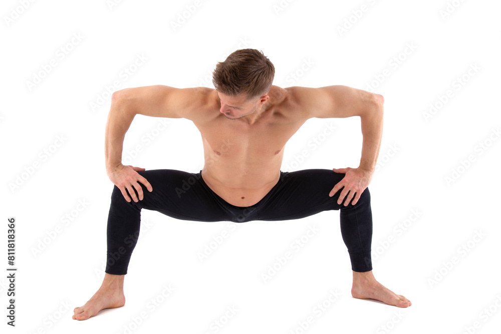 Sports and healthy lifestyle. An attractive man is doing yoga and pilates. White background. Sports and healthy lifestyle. An attractive man is doing yoga and pilates. White background.